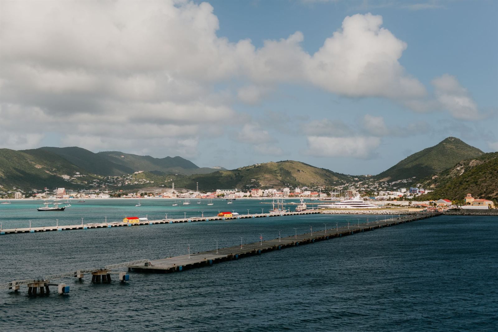 Cruise piers stretching into Great Bay with Philipsburg and green hills behind, St. Maarten